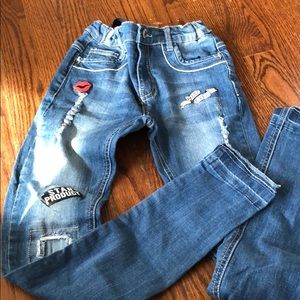 Distressed patch jeans